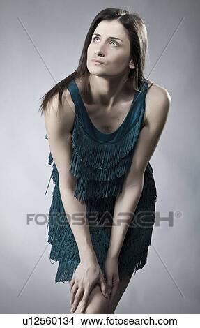 Picture - Woman wearing fringed dress. Fotosearch