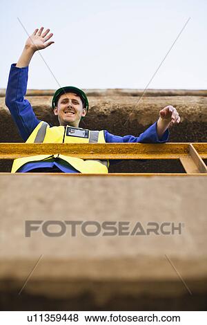 Worker waving from balcony View Large Photo Image Stock Photo - Worker waving from balcony. Fotosearch