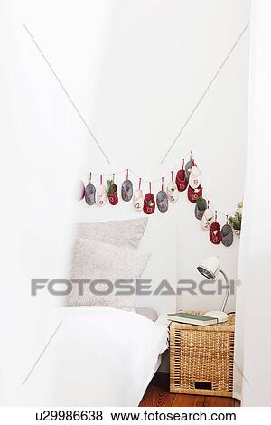 Stock Photo - Advent calendar on bedroom wall. Fotosearch