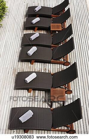 Stock Image - Aerial view of lawn chairs on deck. Fotosearch