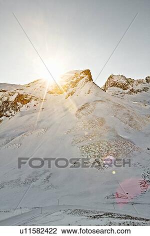 Stock Image - Aerial view of snowy mountain. Fotosearch