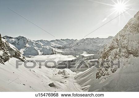 Aerial view of snowy mountains View Large Photo Image Stock Photo - Aerial view of snowy mountains. Fotosearch