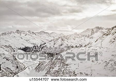 Stock Photo - Aerial view of snowy mountains. Fotosearch