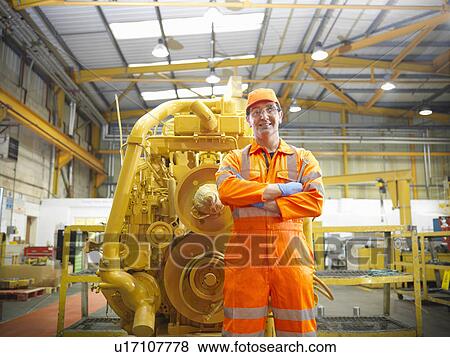 Apprentice engineer in factory View Large Photo Image Stock Photo - Apprentice engineer in factory. Fotosearch