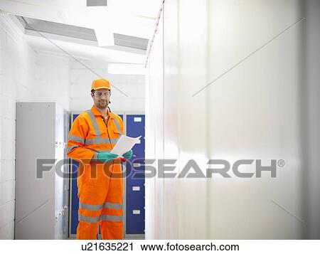 Apprentice engineer standing in hallway View Large Photo Image Stock Image - Apprentice engineer standing in hallway. Fotosearch