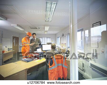 Picture - Apprentice engineer with businessman. Fotosearch