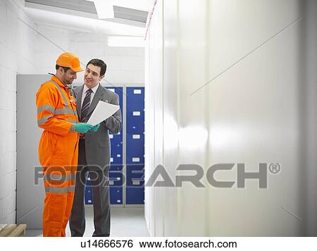 Stock Photograph - Apprentice engineer with businessman. Fotosearch