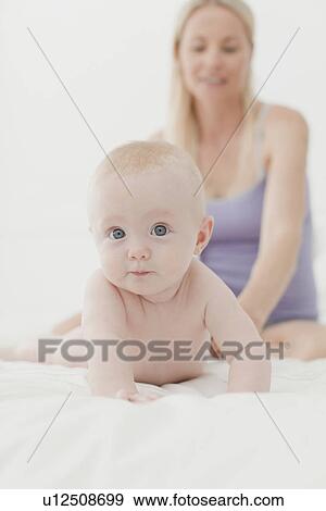 Baby crawling on bed View Large Photo Image Stock Photo - Baby crawling on bed. Fotosearch