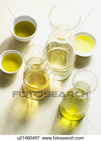 Bottles and bowls of olive oil View Large Photo Image Stock Photo - Bottles and bowls of olive oil. Fotosearch