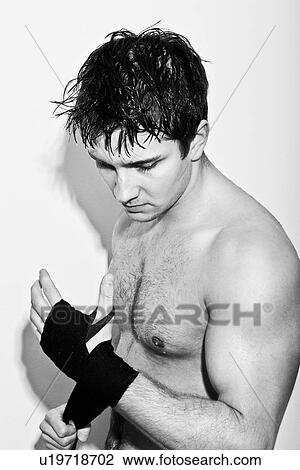 Boxer wrapping his hands View Large Photo Image Stock Image - Boxer wrapping his hands. Fotosearch