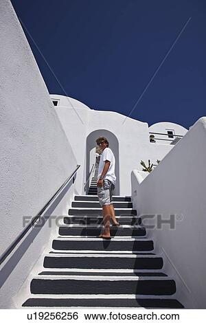 Stock Photograph - Boy climbing staircase outdoors. Fotosearch