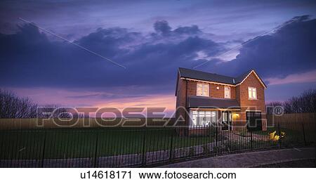 Brick house against sunset sky View Large Photo Image Stock Image - Brick house against sunset sky. Fotosearch