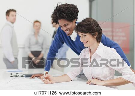 Business people reading in meeting View Large Photo Image Stock Photograph - Business people reading in meeting. Fotosearch
