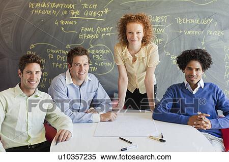 Business people smiling in meeting View Large Photo Image Stock Photography - Business people smiling in meeting. Fotosearch