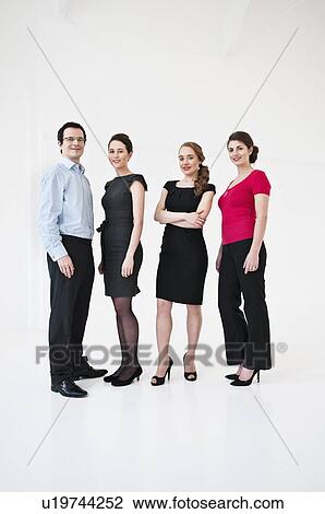 Business people smiling in office View Large Photo Image Stock Image - Business people smiling in office. Fotosearch