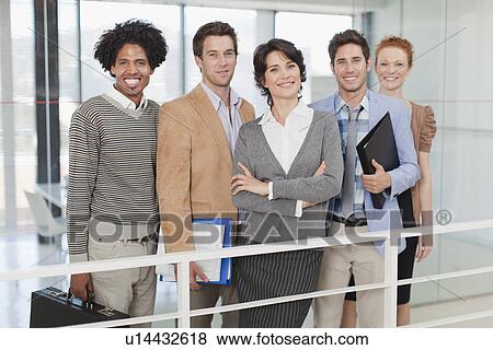Stock Photo - Business people smiling in office. Fotosearch