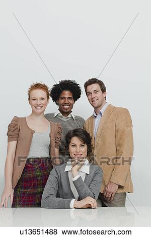 Business people smiling together View Large Photo Image Stock Photo - Business people smiling together. Fotosearch