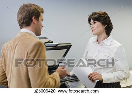 Business people talking at copier View Large Photo Image Stock Image - Business people talking at copier. Fotosearch