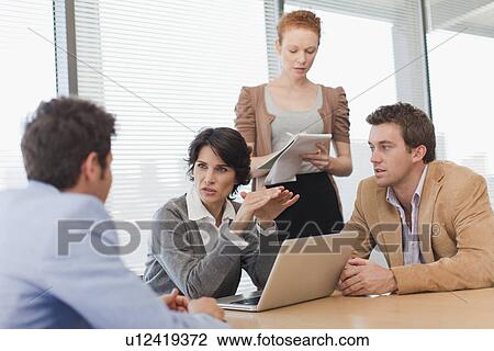 Business people talking in meeting View Large Photo Image Stock Image - Business people talking in meeting. Fotosearch