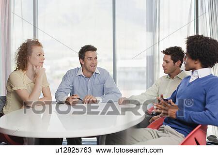 Business people talking in meeting View Large Photo Image Stock Image - Business people talking in meeting. Fotosearch