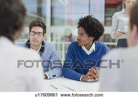 Business people talking in meeting View Large Photo Image Stock Image - Business people talking in meeting. Fotosearch