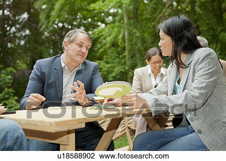 Business people talking in meeting View Large Photo Image Stock Image - Business people talking in meeting. Fotosearch
