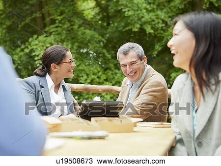 Business people talking in meeting View Large Photo Image Stock Image - Business people talking in meeting. Fotosearch