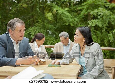 Business people talking in meeting View Large Photo Image Stock Image - Business people talking in meeting. Fotosearch