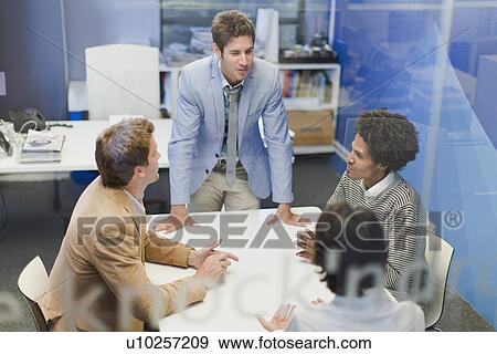 Stock Photo - Business people talking in meeting. Fotosearch