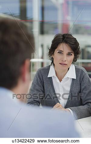 Stock Photo - Business people talking in meeting. Fotosearch