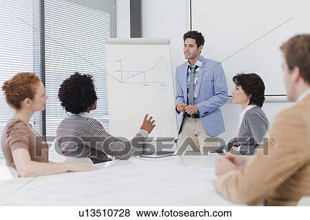 Stock Photo - Business people talking in meeting. Fotosearch