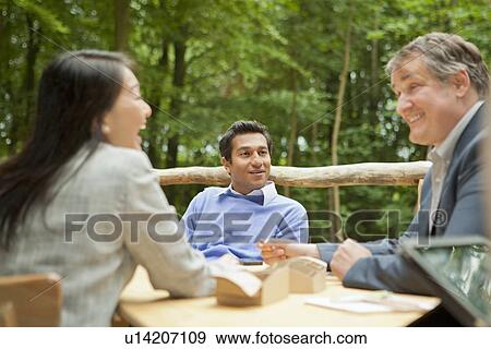 Business people talking in meeting View Large Photo Image Stock Photo - Business people talking in meeting. Fotosearch