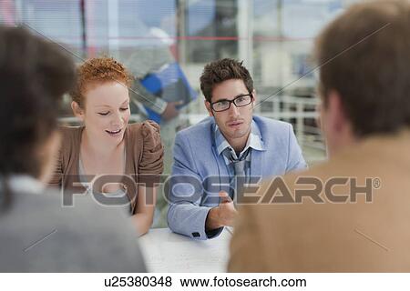 Business people talking in meeting View Large Photo Image Stock Photo - Business people talking in meeting. Fotosearch