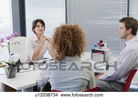 Business people talking in office View Large Photo Image Picture - Business people talking in office. Fotosearch