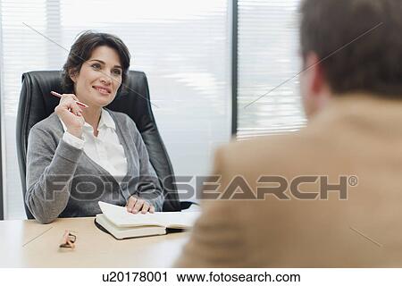 Business people talking in office View Large Photo Image Stock Image - Business people talking in office. Fotosearch