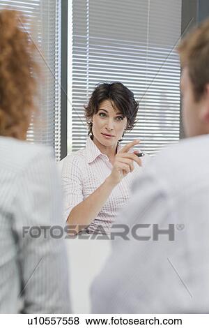 Business people talking in office View Large Photo Image Stock Photo - Business people talking in office. Fotosearch