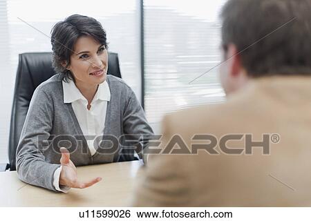 Business people talking in office View Large Photo Image Stock Photograph - Business people talking in office. Fotosearch
