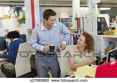 Stock Image - Business people working in office. Fotosearch