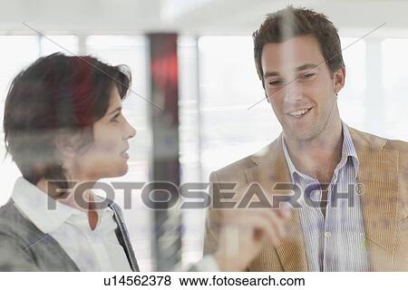 Stock Photo - Business people writing on glass. Fotosearch