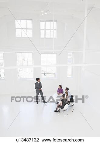 Businessman giving presentation View Large Photo Image Stock Image - Businessman giving presentation. Fotosearch