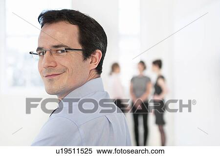 Businessman looking over shoulder View Large Photo Image Stock Photography - Businessman looking over shoulder. Fotosearch