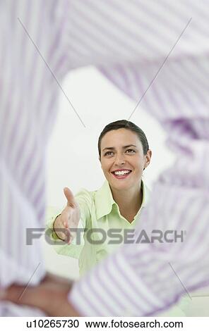Businesswoman extending hand in greeting View Large Photo Image Stock Image - Businesswoman extending hand in greeting. Fotosearch