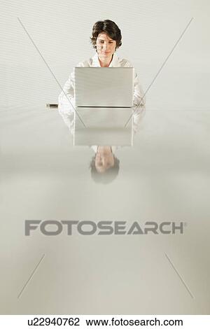 Businesswoman reflected in table View Large Photo Image Stock Image - Businesswoman reflected in table. Fotosearch