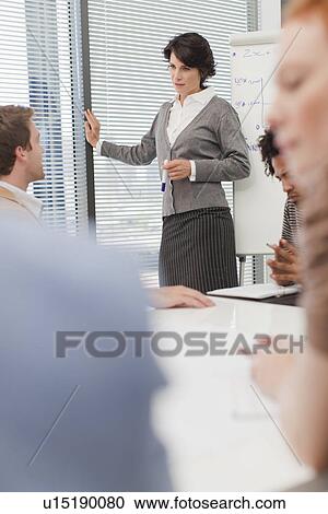 Businesswoman talking in meeting View Large Photo Image Stock Image - Businesswoman talking in meeting. Fotosearch