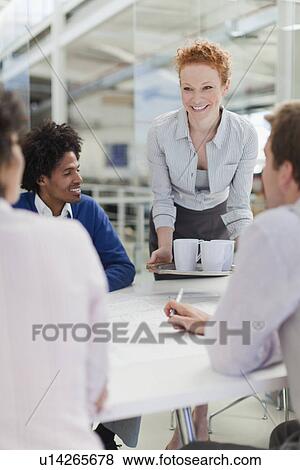 Businesswoman with tray of coffee View Large Photo Image Stock Photo - Businesswoman with tray of coffee. Fotosearch