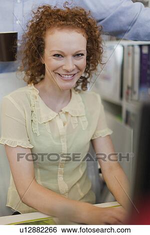 Businesswoman working at computer View Large Photo Image Stock Photograph - Businesswoman working at computer. Fotosearch