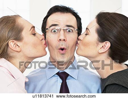Businesswomen kissing colleagues cheeks View Large Photo Image Stock Image - Businesswomen kissing colleagues cheeks. Fotosearch