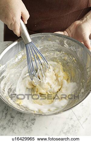Stock Photography - Chef whisking dough in bowl. Fotosearch