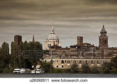 Stock Image - City skyline on still lake. Fotosearch
