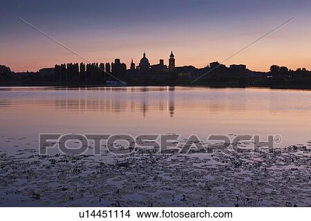 City skyline reflected in lake at sunset View Large Photo Image Picture - City skyline reflected in lake at sunset. Fotosearch